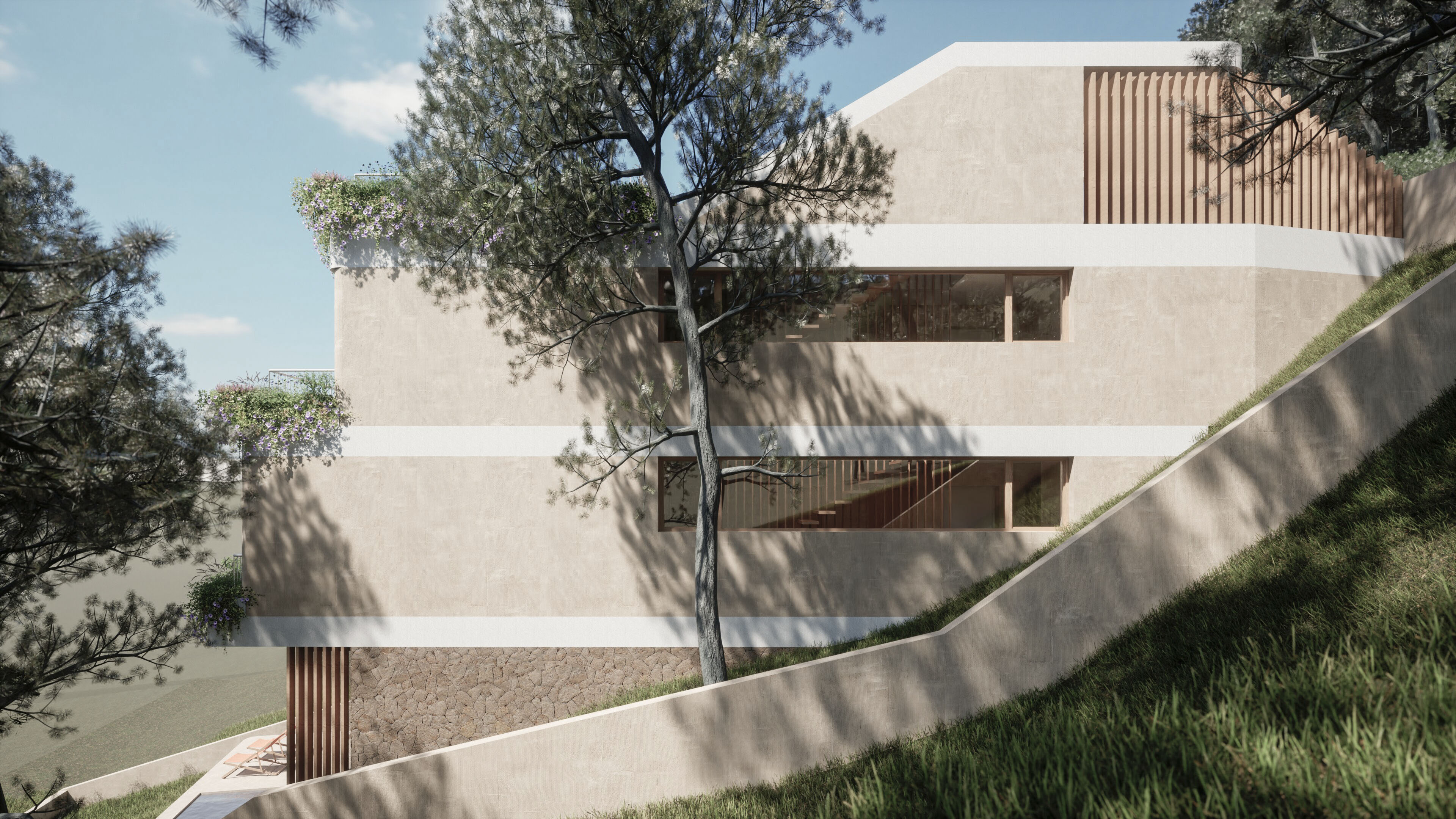 Fachada de la vivienda entre los pinos de la ladera